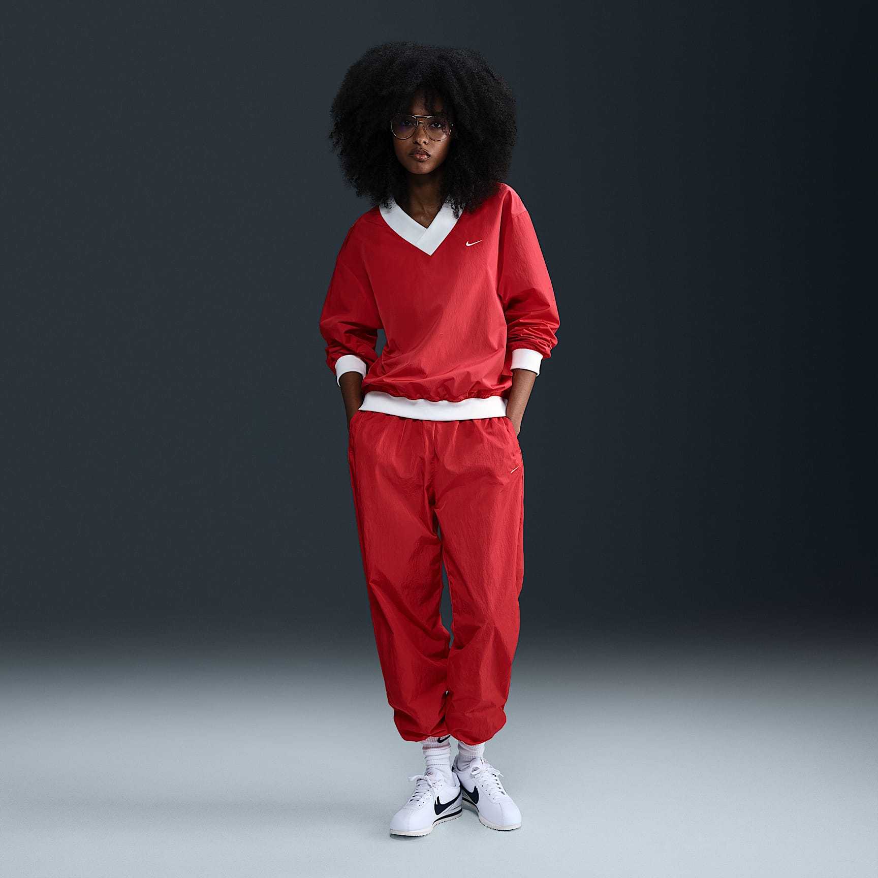 Nike Sportswear Essential Women's Loose UV Woven Long-Sleeve V-Neck Top