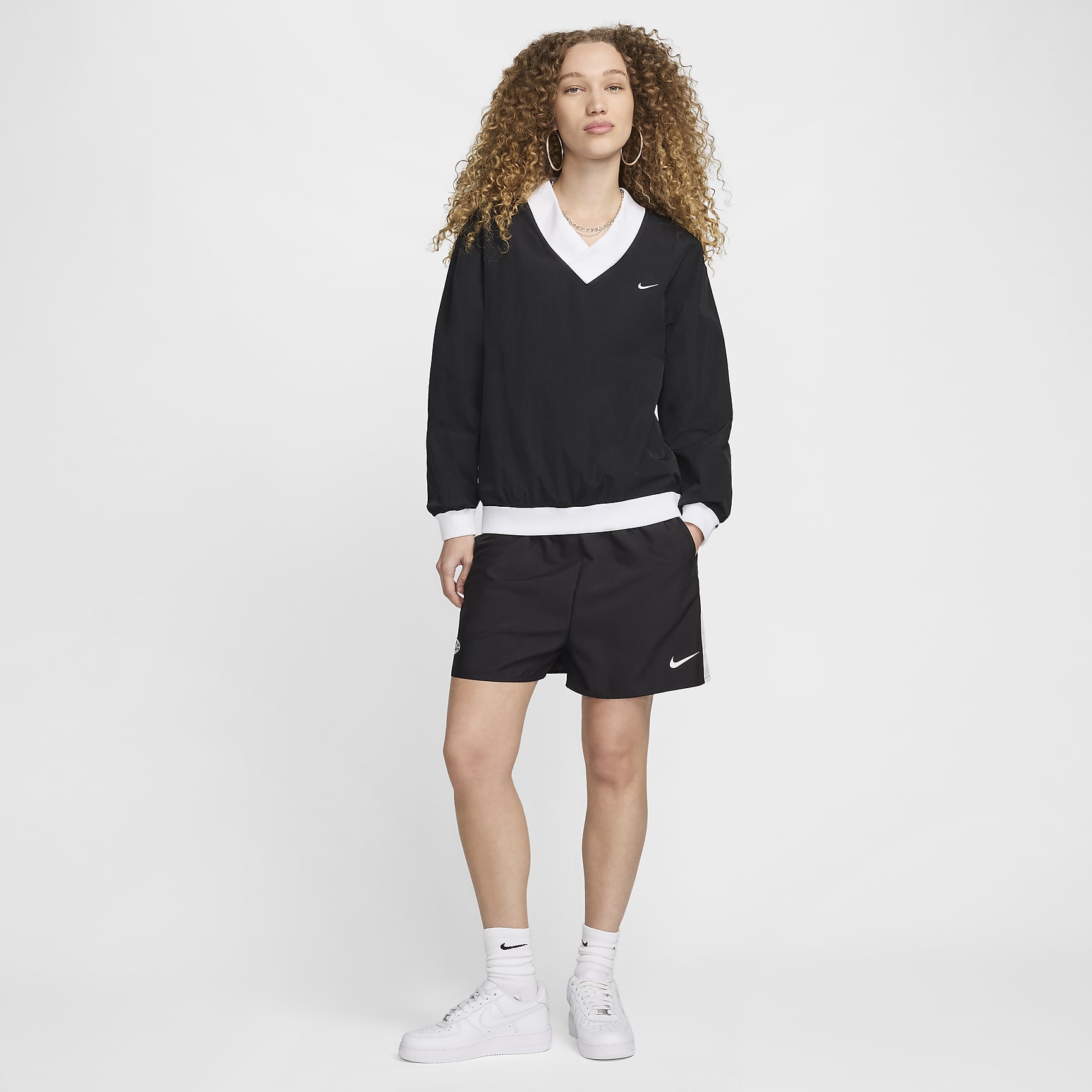 Nike Sportswear Essential Women's Loose UV Woven Long-Sleeve V-Neck Top