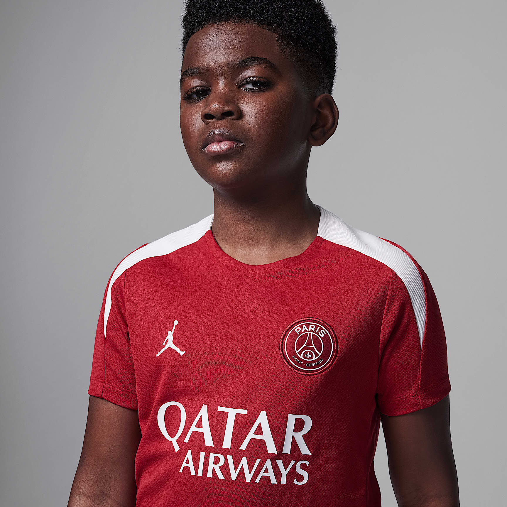 Paris Saint-Germain Strike Fourth Big Kids' Jordan Dri-FIT Soccer Knit Short-Sleeve Top