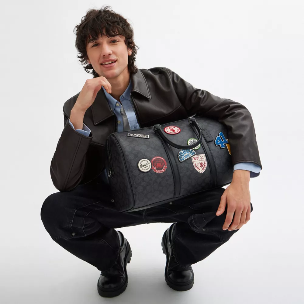 Сумка COACH Venturer Bag In Signature Canvas With Patches