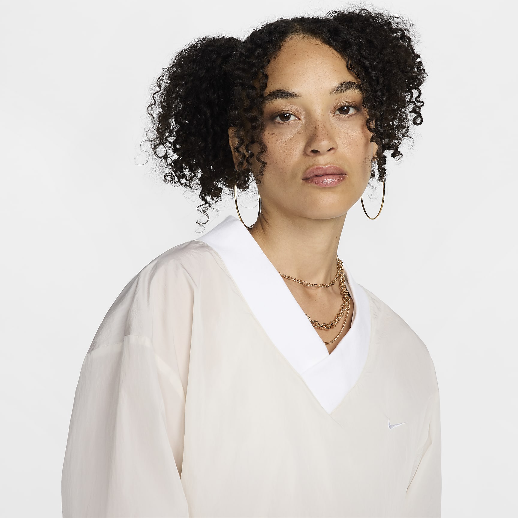 Nike Sportswear Essential Women's Loose UV Woven Long-Sleeve V-Neck Top
