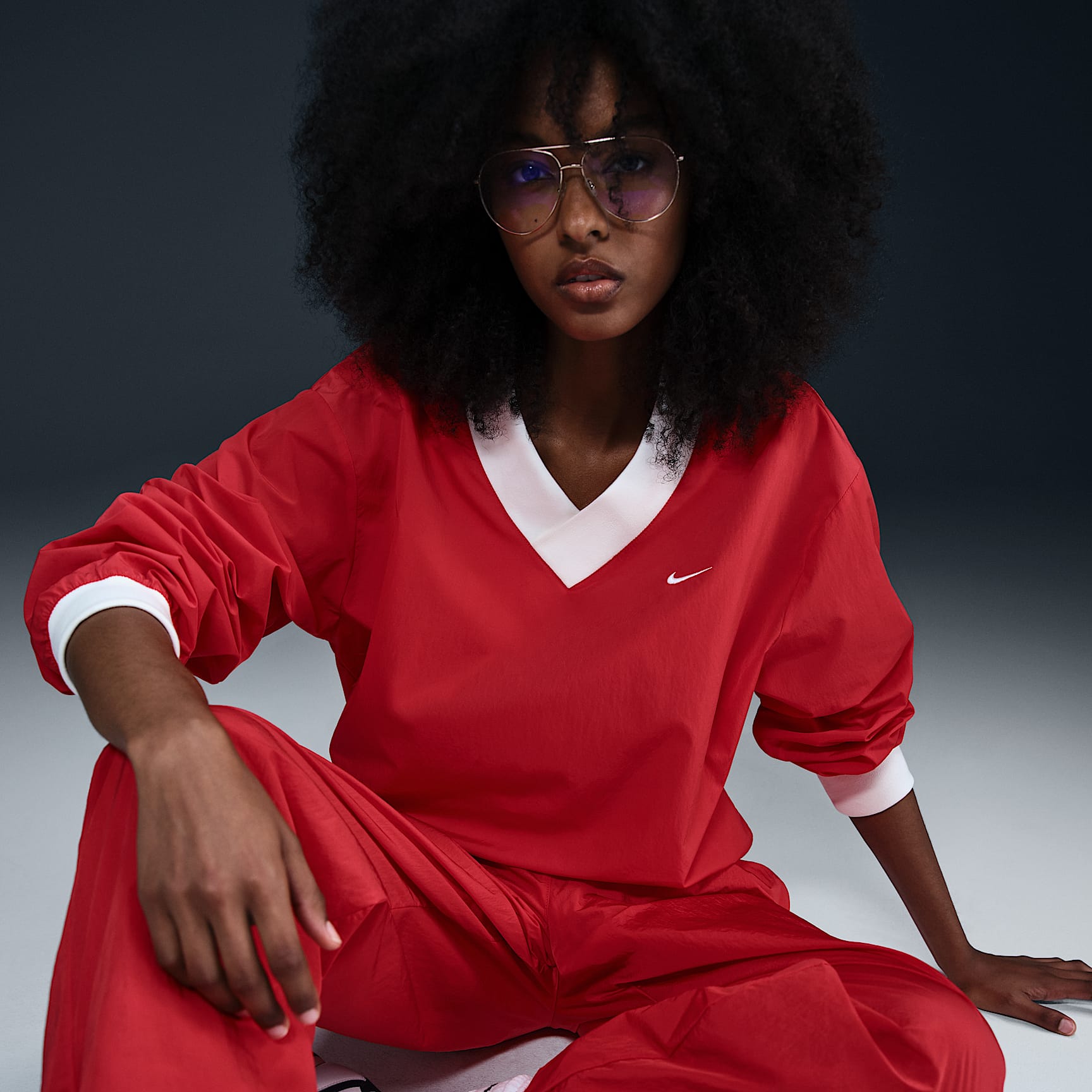 Nike Sportswear Essential Women's Loose UV Woven Long-Sleeve V-Neck Top