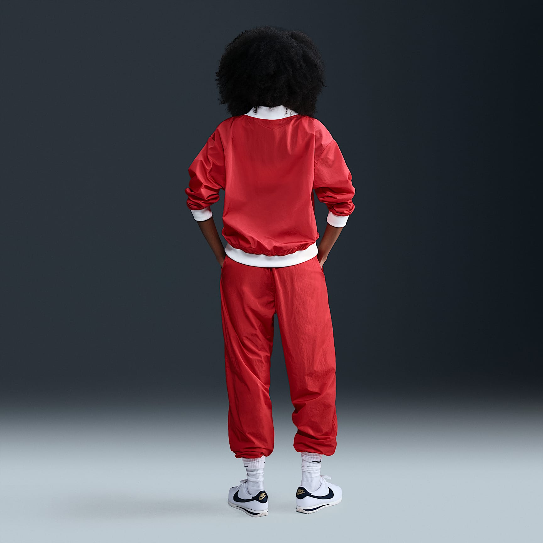 Nike Sportswear Essential Women's Loose UV Woven Long-Sleeve V-Neck Top
