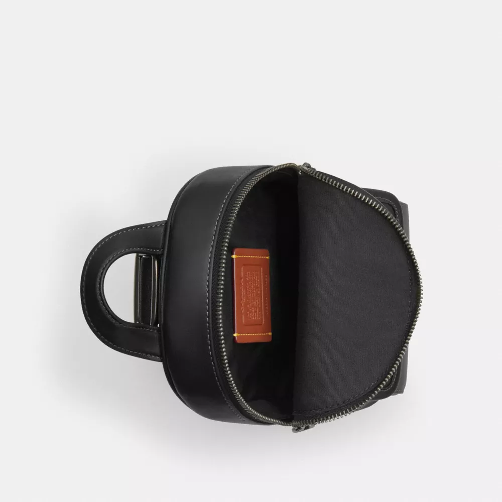 Сумка COACH Small Turnlock Sling Pack