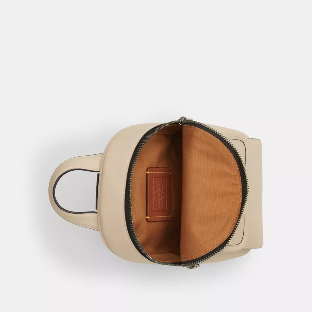 Сумка COACH Small Turnlock Sling Pack