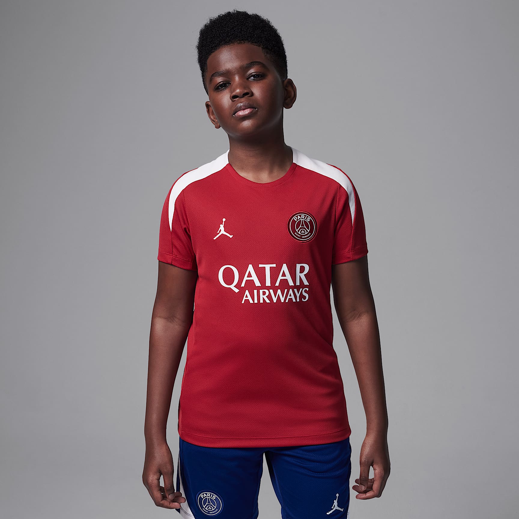 Paris Saint-Germain Strike Fourth Big Kids' Jordan Dri-FIT Soccer Knit Short-Sleeve Top