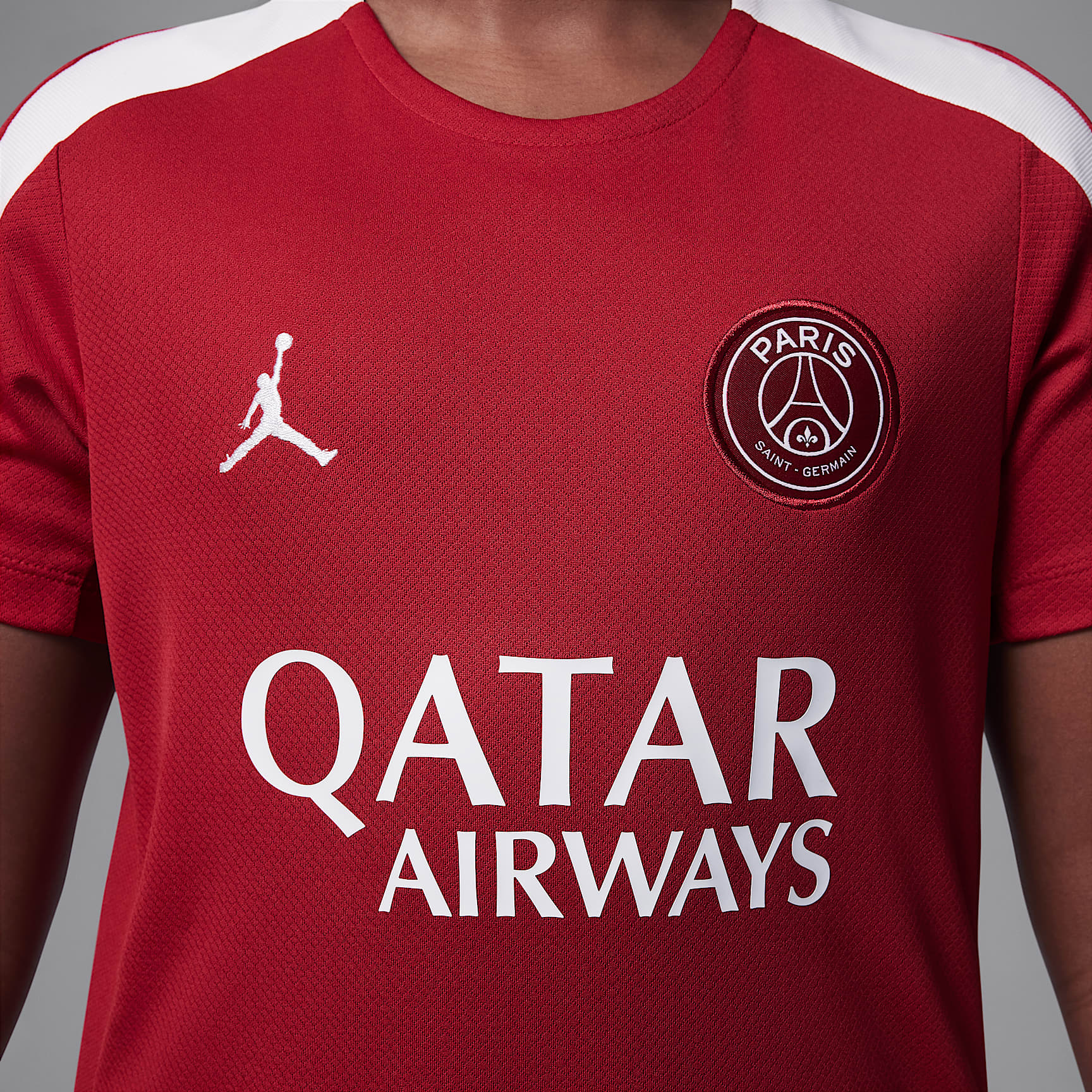 Paris Saint-Germain Strike Fourth Big Kids' Jordan Dri-FIT Soccer Knit Short-Sleeve Top